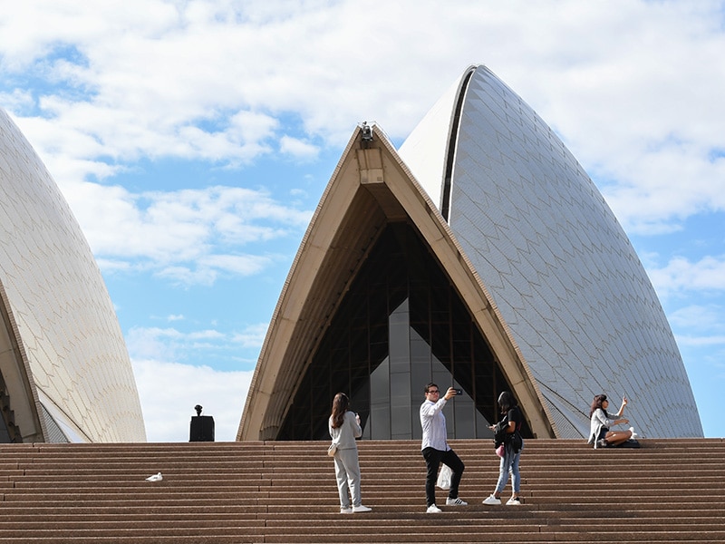 Tourists standing on operahouse stairs